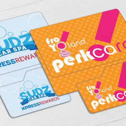 Loyalty cards for a carwash and a frozen yogurt shop, each accompanied by a key tag.