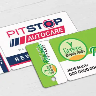 Loyalty card for an automotive service and grocery store, featuring a detachable key tag.