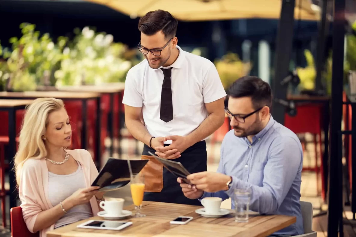 Couple ordering from menu