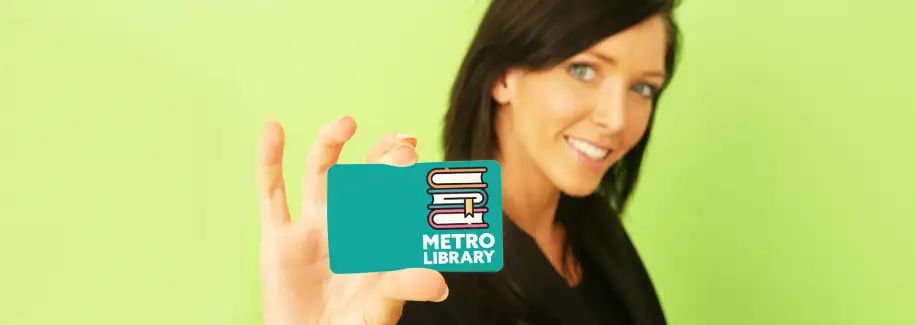 Woman holding library card