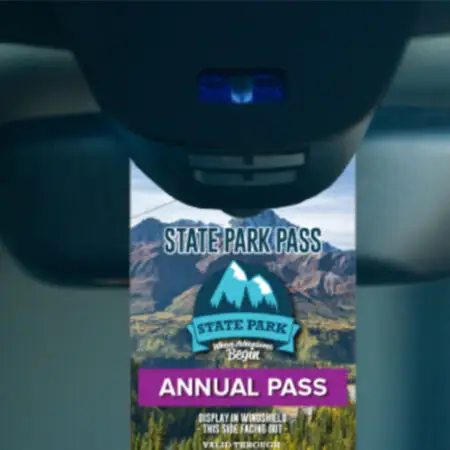 Parking pass hanging on rear view mirror