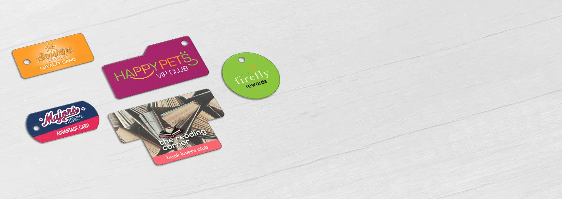 A collection of single Teslin® key tags in various shapes, designed for diverse retail environments including a sporting goods store, dry cleaning service, pet shop, bookstore, and women’s boutique.