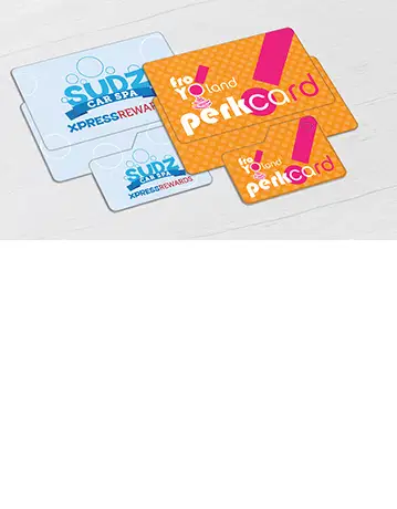 Loyalty cards for a carwash and a frozen yogurt shop, each accompanied by a key tag.